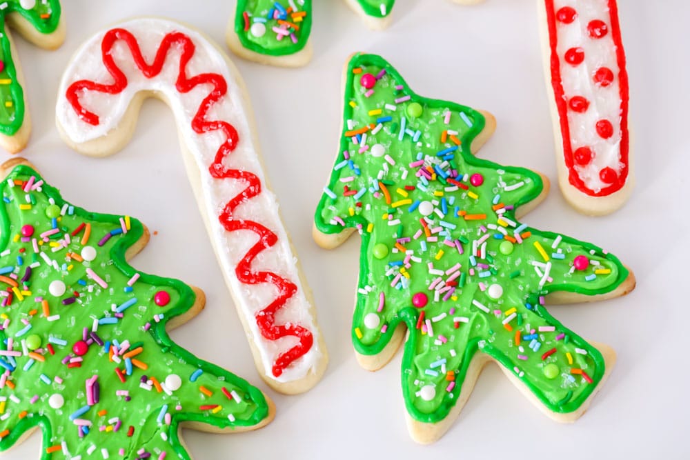 Christmas sugar cookies on a white countertop.