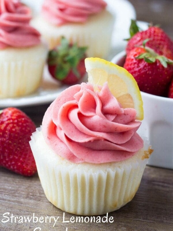 These Strawberry Lemonade Cupcakes are so pretty and perfect for spring or summer. They start with fluffy, moist lemon cupcakes. Then they're topped with strawberry frosting made from fresh berries!